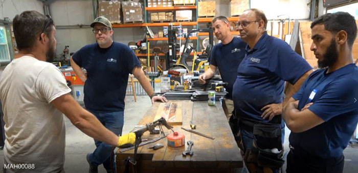 Brent Ulisky demonstrating soldering techniques at the Slate Roof Training Center. Brent Ulisky demonstrating soldering techniques at the Slate Roof Training Center.